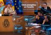 Crisis energética Tenerife: cuando la geopolítica entra por la cesta Imagen retocada del pleno del Cabildo de Tenerife con efectos holográficos sobre la crisis energética en Tenerife. La escena muestra a representantes institucionales en el salón de plenos, con gráficos luminosos superpuestos sobre combustibles, transporte y logística, agua y desalación, inflación, cesta de la compra y transición energética. La imagen relaciona el debate político insular con el impacto económico de Oriente Medio y la necesidad de reducir la dependencia del petróleo.