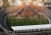 Futuro del Heliodoro: plan, retrasos y credibilidad Vista aérea del estadio Heliodoro Rodríguez López con la imagen difuminada del pleno del Cabildo de Tenerife superpuesta sobre el terreno de juego.