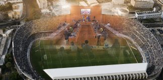 Futuro del Heliodoro: plan, retrasos y credibilidad Vista aérea del estadio Heliodoro Rodríguez López con la imagen difuminada del pleno del Cabildo de Tenerife superpuesta sobre el terreno de juego.